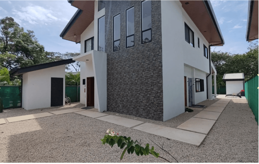 Vue latérale extérieure Formes Villa côté extérieur maison moderne samara costa rica